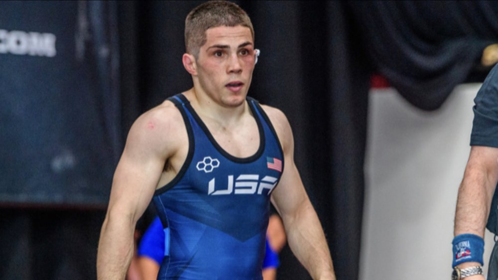 Wrestlers competing on a mat